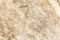 The texture of granite beige, background, close-up. Space for text