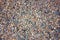 Texture of gray gravel. Grey stony floor. A wall of gray gravel. Stones small and medium-sized. Sharp edges of the