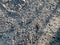 The texture of a gray stone broken, crumbling cement stone floor, walls of old reinforced concrete. The background