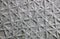 Texture gray wall with different stripes in the form of snowflakes