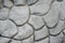 Texture of gray wall plastered in form of stones