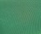 Texture of a green woven synthetic waterproof fabric