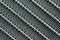 Texture of a honeycomb of an automotive aluminum car cooling radiator, close-up.