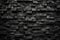 texture illustration of black colored brick wall background. Generative AI