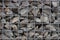 Texture of the iron gray mesh and stones