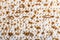 Texture of jewish passover matzah unleavened bread. Symbol of jewish passover. Jewish bread matzo background, top view