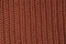 Texture of knitted brown fabric macro