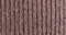 The texture of the knitted part is close-up. Macro fragment. Brown background.