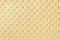 Texture of light yellow and golden leather background with capitone pattern