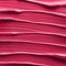 Texture of liquid lipstick in red Viva Magenta red color 2023 as background