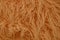 Texture of long wool of orange color from a piece of clothing