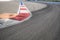 Texture of motor race asphalt and red white curb. Close up on Grand Prix street circuit