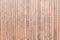 Texture of narrow light wood planks with veins and knots. Vertical narrow boards