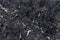 Texture of natural polished dark stone. Abstract background