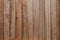 Texture of natural wood slats unvarnished. Copper, reddish, cherry. Vertical sense