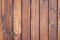 Texture of natural wooden planks located vertically. Background in shades of brown. Scenery and interior design of rooms