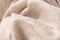 Texture of natural wool cream colored fabric