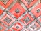 Texture of an old ancient medieval red antique sturdy iron metal door with rivets and nails patterns. The background