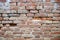 Texture of old brick, background of crumbling brickwork wall