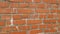 The texture of an old brick wall made of brown brick. Vintage wall background