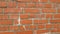 The texture of an old brick wall made of brown brick. Vintage wall background