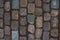 The texture of the old cobblestone and unusual stones. Patterned paving tiles cobblestone road for texture. Top view