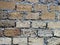 Texture of old dilapidated shabby coquina masonry wall foreground closeup in Crimea