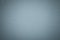 Texture of old gray paper background, closeup. Structure of dense light blue cardboard.