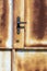 Texture of old metal rusty door with lock