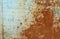 Texture of old rusty metal, painted white which becames orange from rust
