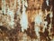 Texture of old rusty metal with streaks of rust and cracked, flaking paint. Surface of rusty metal close-up with old and