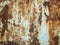 Texture of old rusty metal with streaks of rust and cracked, flaking paint. Surface of rusty metal close-up with old and