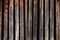 A texture of old thin crooked wooden planks