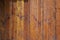Texture of the old wooden wall from a number of scratched planks that are varnishe