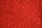 Texture of openwork lace red fabric for clothing. background for the design.