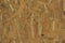 Texture of OSB with the strips lying unevenly across each other