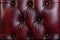 Texture and pattern of red dark leather. Luxury texture, luxury leather button-tufted red chair texture