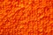 Texture of pile of orange fabric. Macro. Closeup. on a