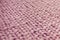Texture of pink knit blanket. Large knitting. Plaid merino wool.
