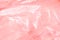 The texture of the pink polyethylene package. Background for cards