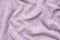 The texture of the purple fabric. Background of clothing details