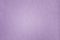 Texture of purple paper with irregularities and embossed close-up. Background for layouts.