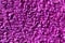 Texture of a purple soft shaggy carpet