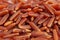 Texture of raw long grains of red rice, food