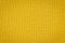 Texture of real yellow knitwear, textile background.