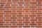 Texture red brick wall. Background from new brown bricks with white