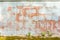 Texture of red fluted brick wall with white peeling paint