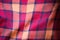 The texture of the red wool plaid fabric