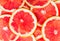 Texture of a ripe grapefruit slice