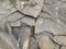 Texture of rocks. Gray mountain rocks background. Gray rock texture. Rough structure. Rock background. Mineral texture